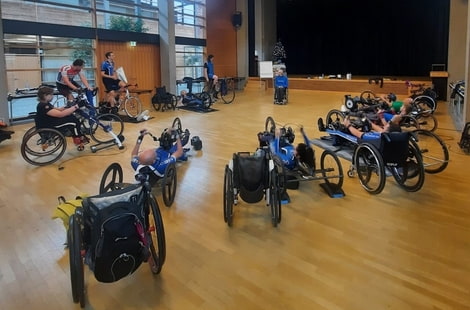 Handbikers train in a hall